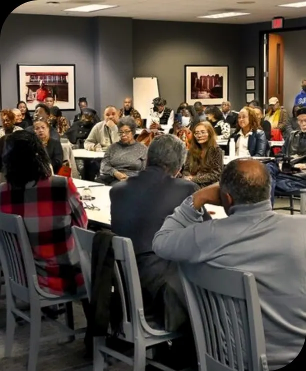 a group of people sitting in a room